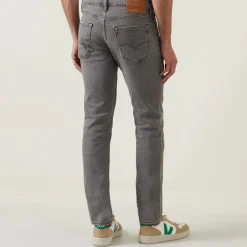 511™ Mid-Rise Slim Leg Jeans