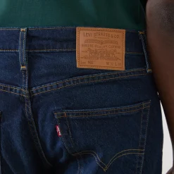 502™ Mid-Rise Tapered Jeans