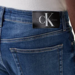 Mid Rise Slim Leg Jeans