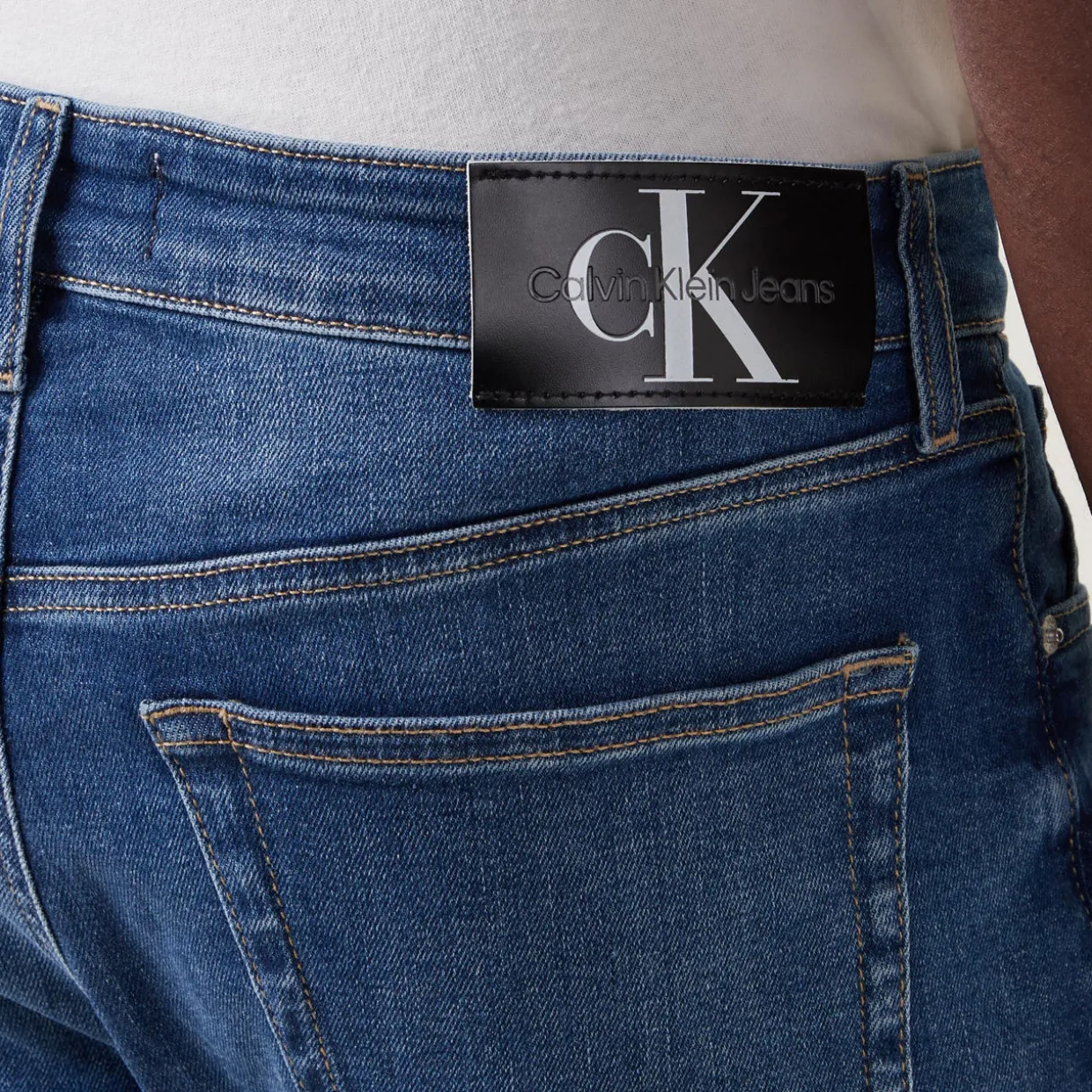 Mid Rise Slim Leg Jeans