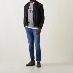 Mid Rise Slim Leg Jeans