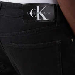 Mid Rise Slim Leg Jeans